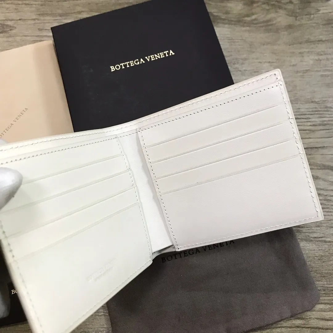Padded leather wallet • 8 card slots, 1 bill compartment and 2 additional compartments • Check pattern nappa padding exterior • Smooth calfskin lining 778#